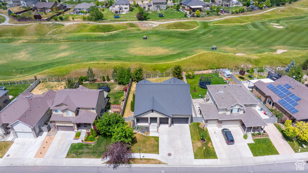 Aerial view of residential area featuring a golf club