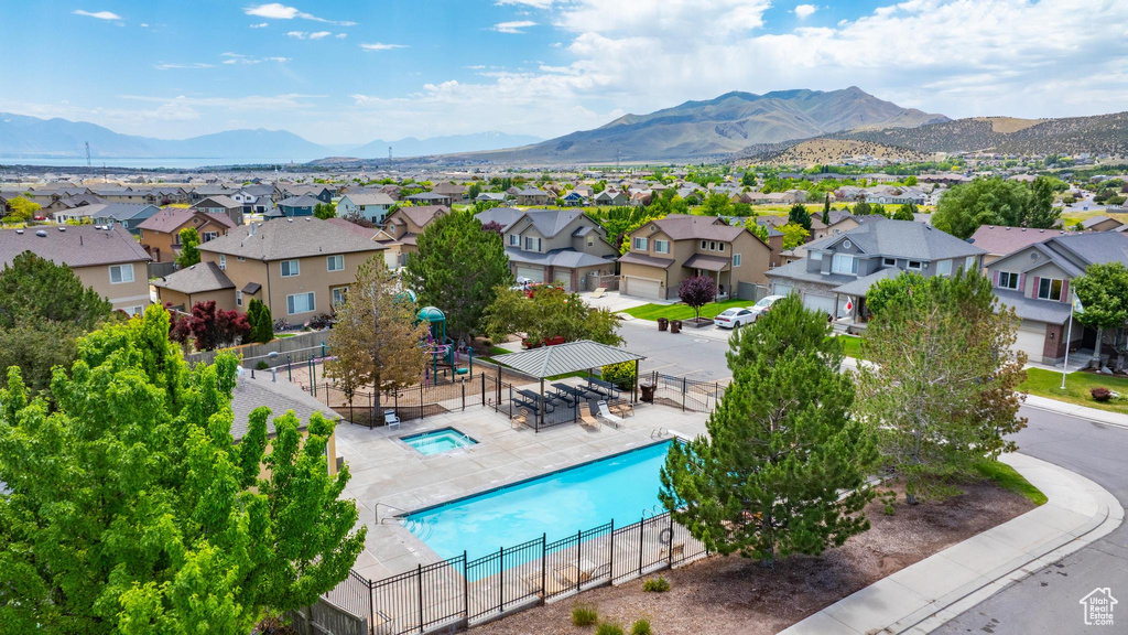 Aerial view of residential area with a mountainous background