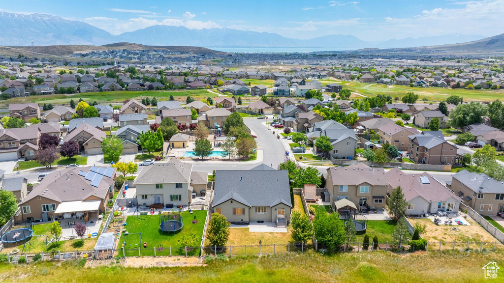 Aerial perspective of suburban area with a mountain backdrop
