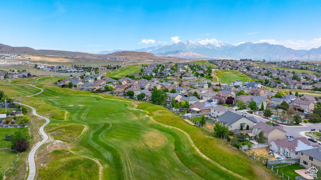 Aerial view of property\\\'s location with nearby suburban area, a mountain backdrop, and a local golf course
