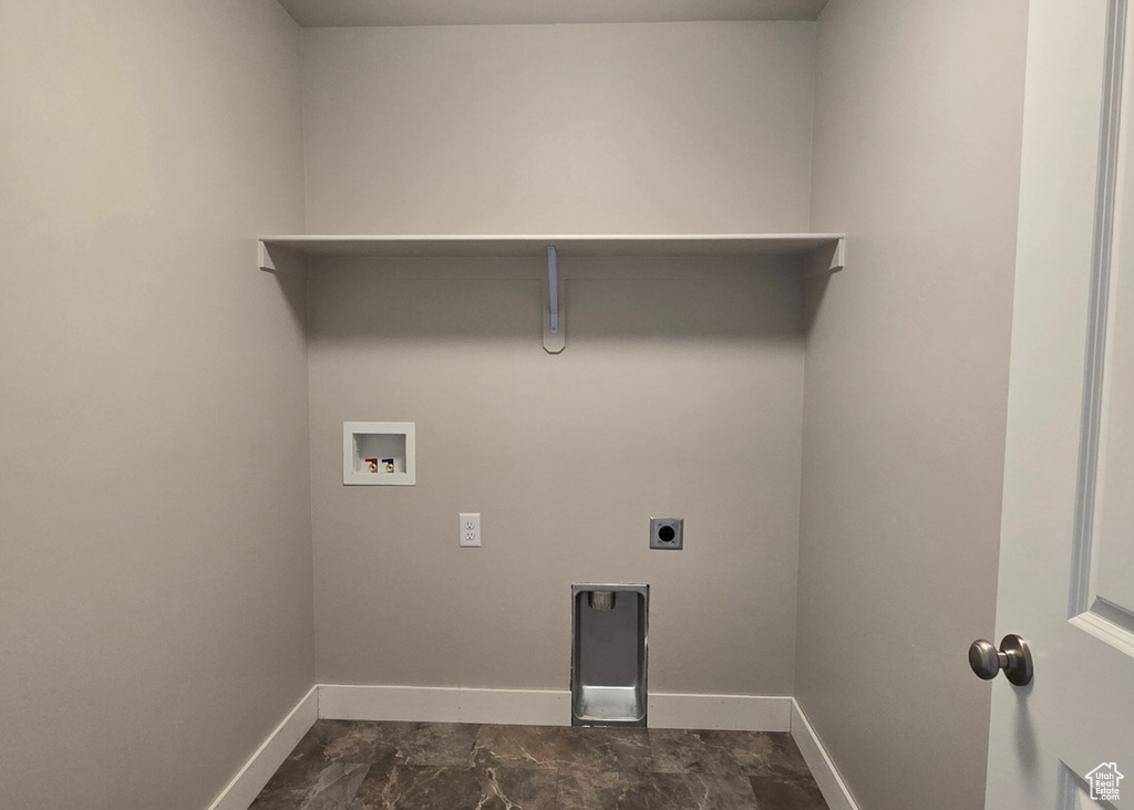 Laundry area with hookup for a washing machine and hookup for an electric dryer