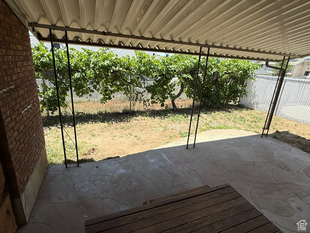 Fenced backyard featuring a patio area