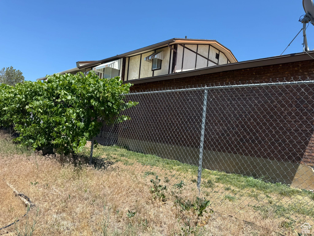 View of side of property with brick siding