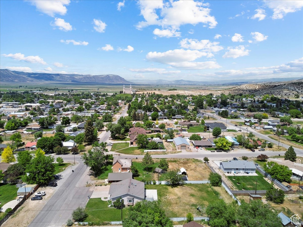 Aerial view of residential area featuring a mountain backdrop