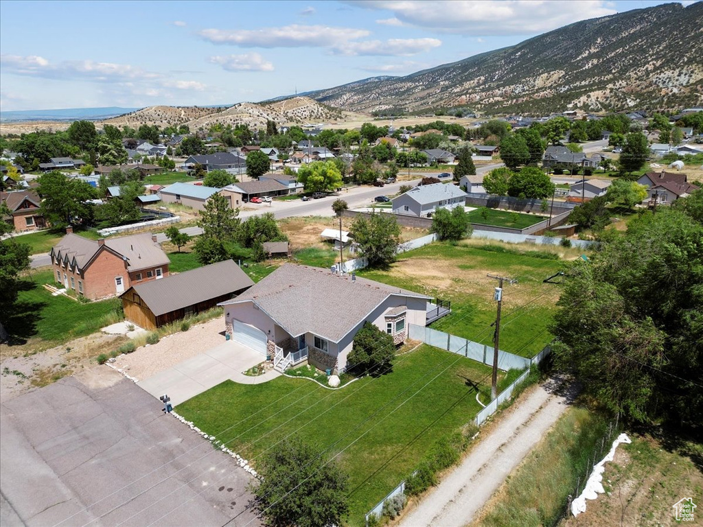 Aerial perspective of suburban area with a mountainous background