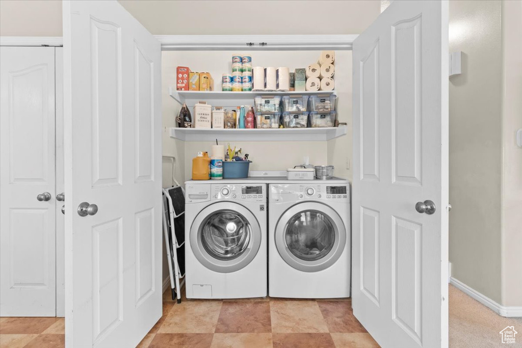 Laundry area featuring independent washer and dryer