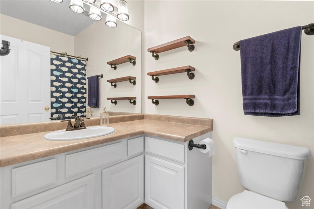 Bathroom with vanity and toilet