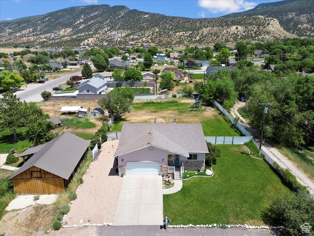 Aerial view of residential area featuring a mountain backdrop