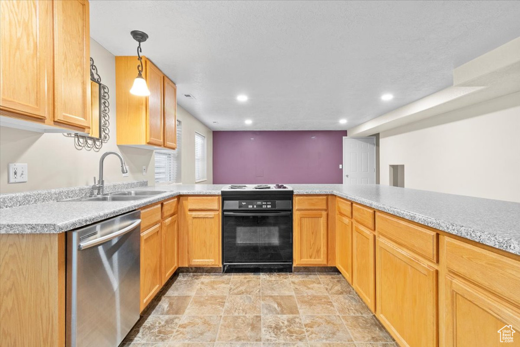 Kitchen with black range, dishwasher, light countertops, recessed lighting, and a peninsula