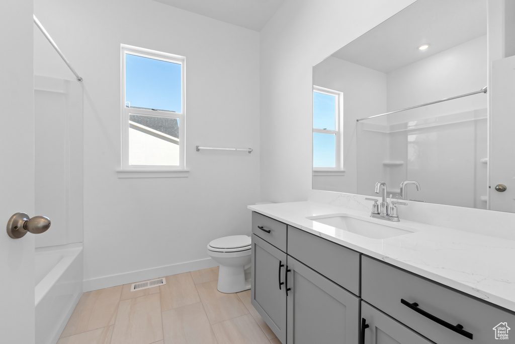 Bathroom featuring vanity and shower / bathtub combination