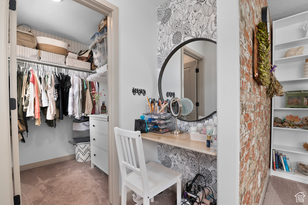 Spacious closet featuring carpet