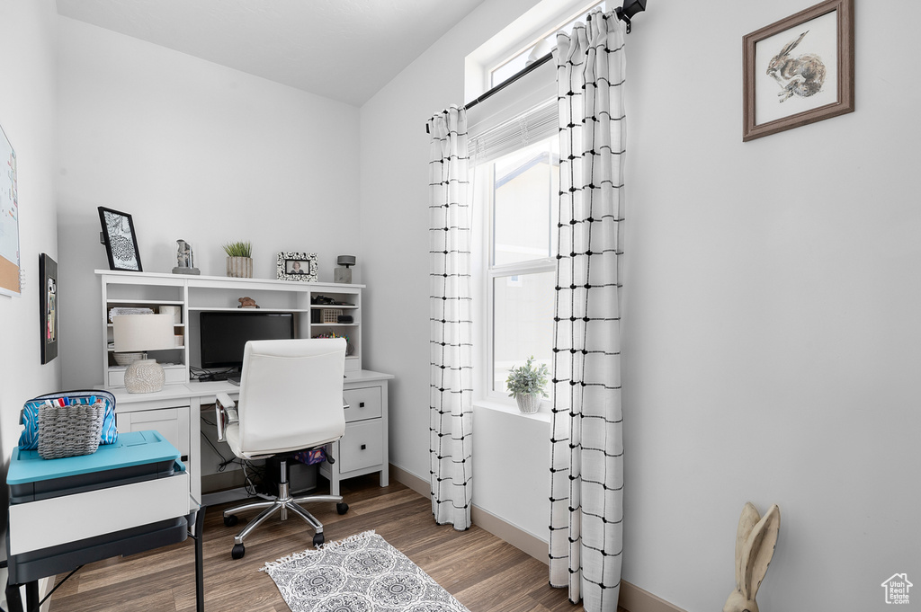 Office featuring wood finished floors and baseboards