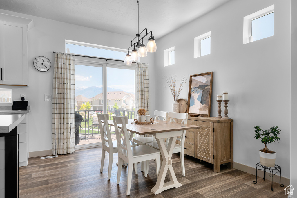 Dining room featuring wood finished floors and baseboards