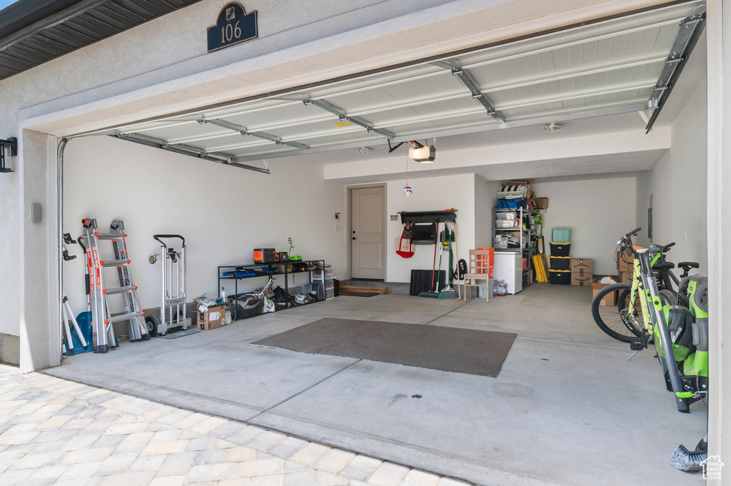 Garage featuring a garage door opener