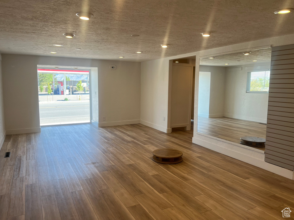 Spare room with recessed lighting and wood finished floors