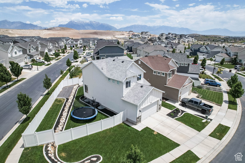 Aerial view of residential area featuring a mountain backdrop