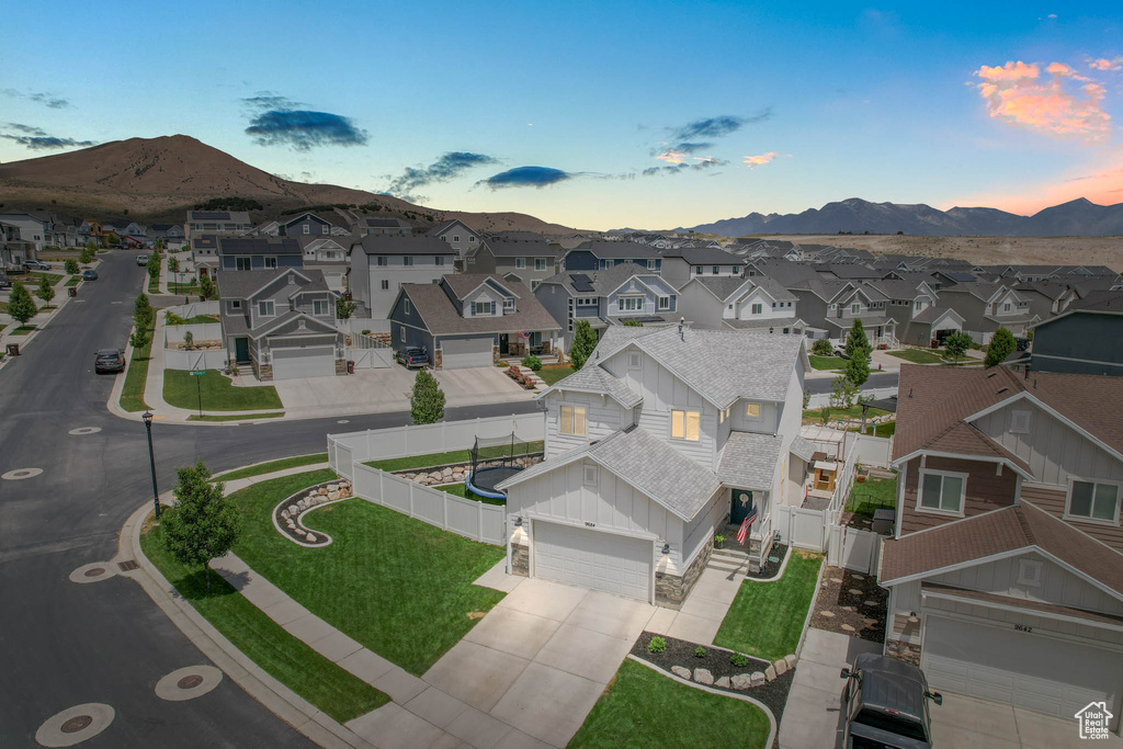 Aerial view of residential area featuring mountains