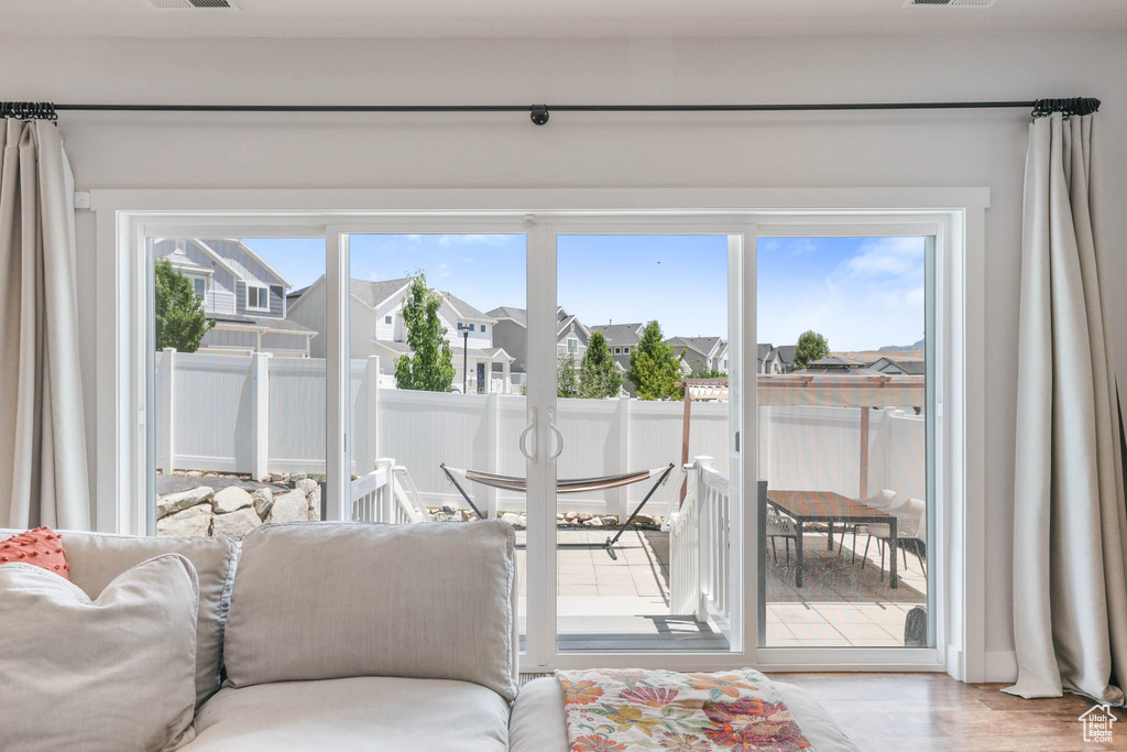 Living room with a residential view and wood finished floors