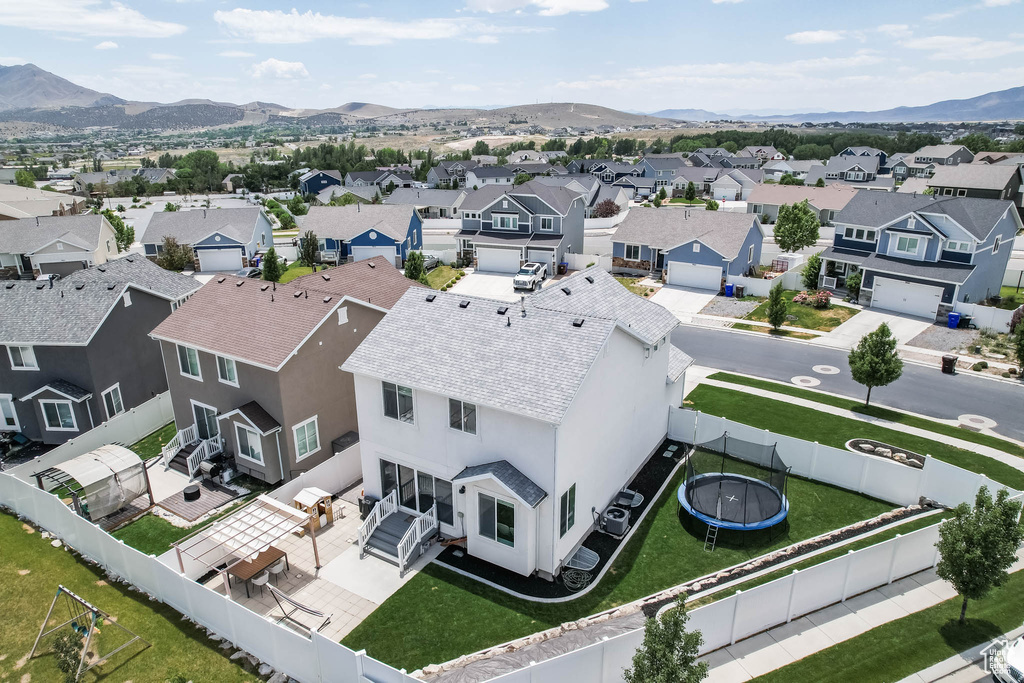 Aerial perspective of suburban area with a mountain backdrop