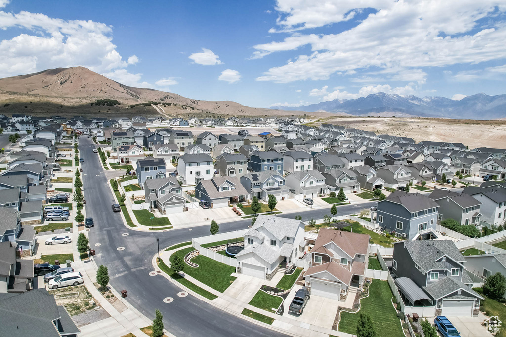 Aerial view of property\'s location with nearby suburban area and a mountain backdrop