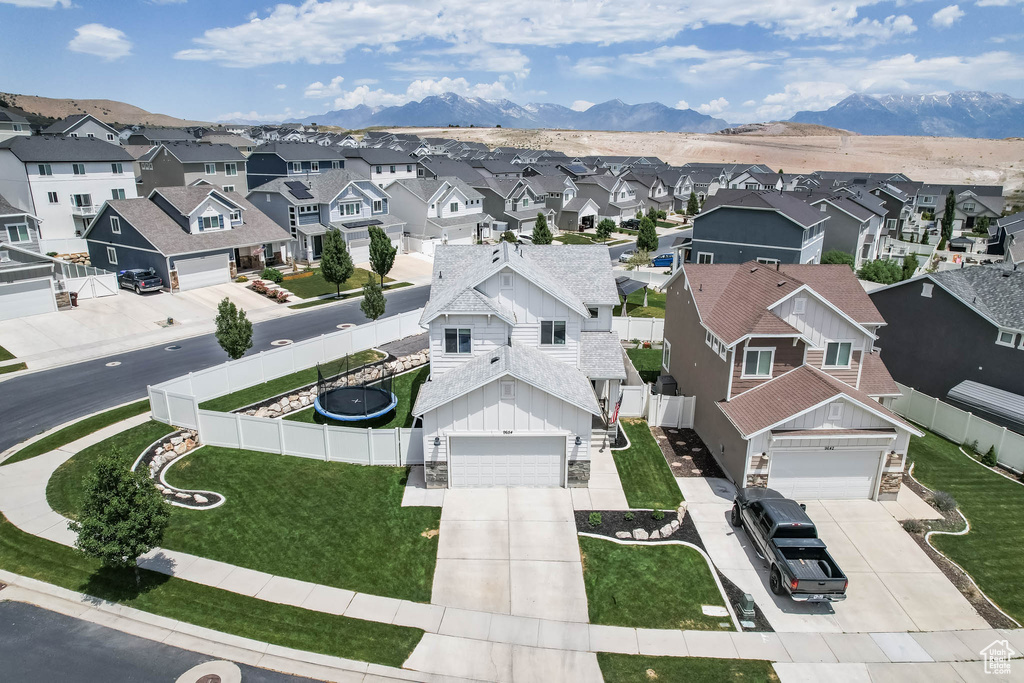 Aerial perspective of suburban area with a mountain backdrop