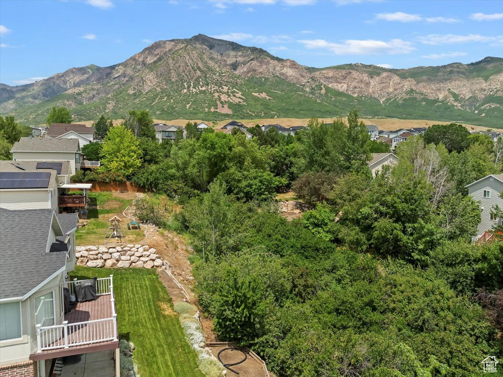 View of mountain backdrop featuring nearby suburban area