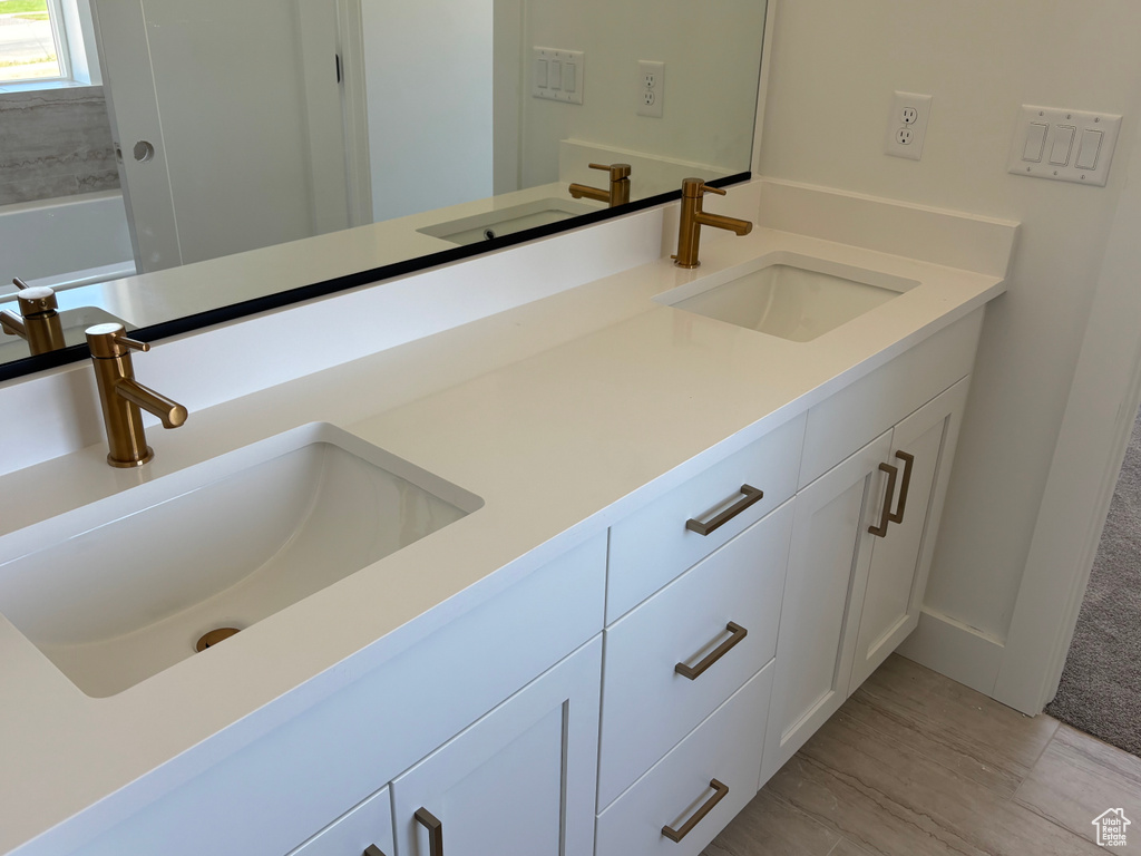 Bathroom featuring double vanity