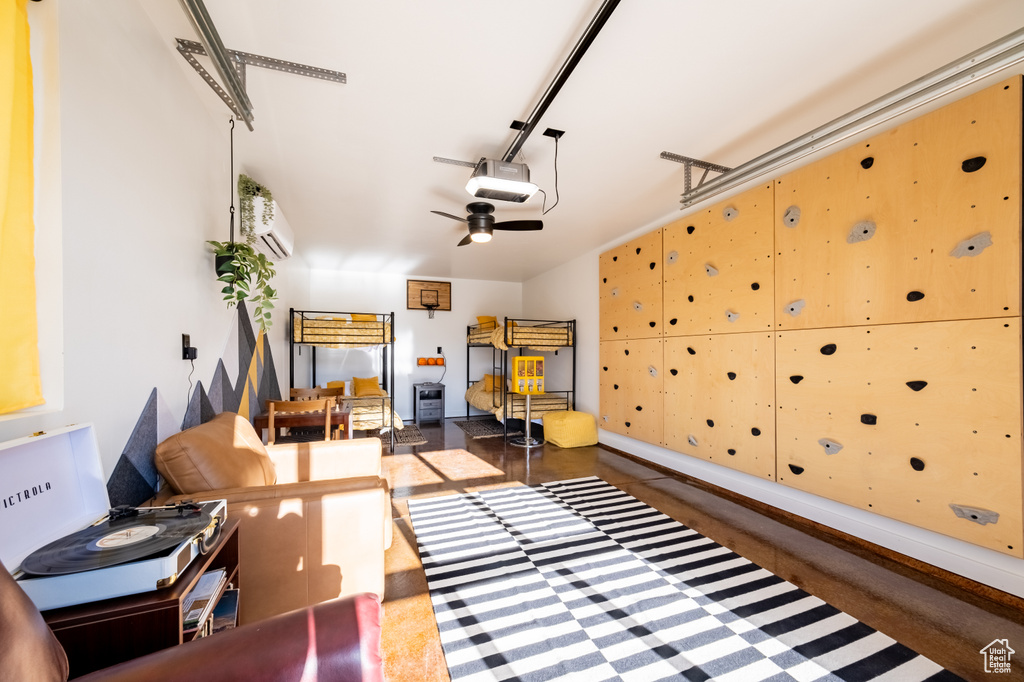 Garage with a garage door opener and ceiling fan
