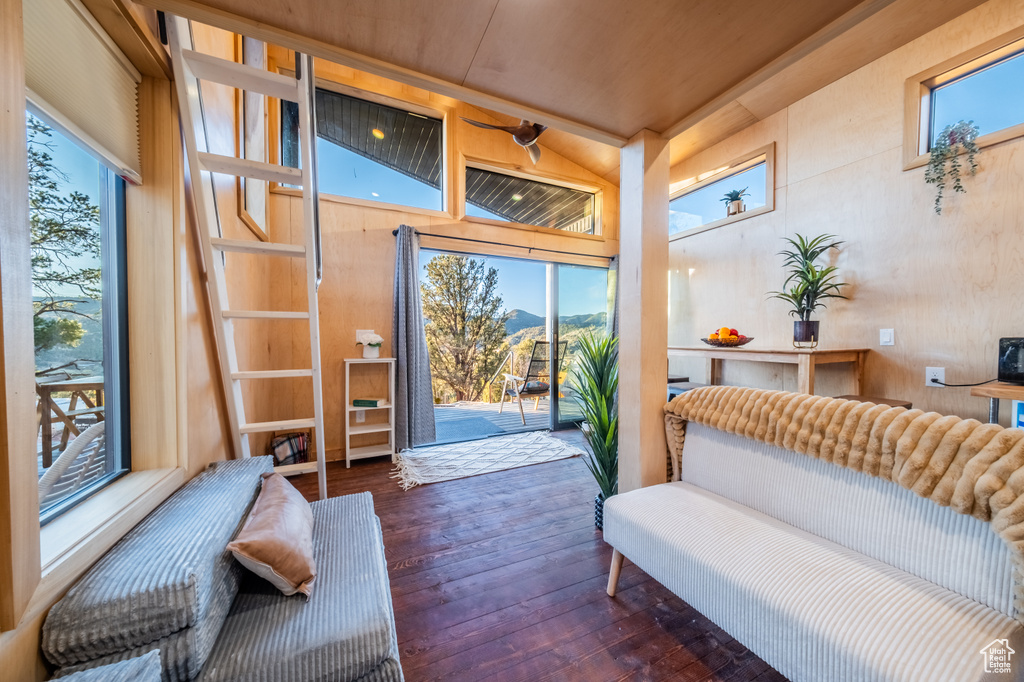Living room with wood-type flooring, healthy amount of natural light, and a mountain view