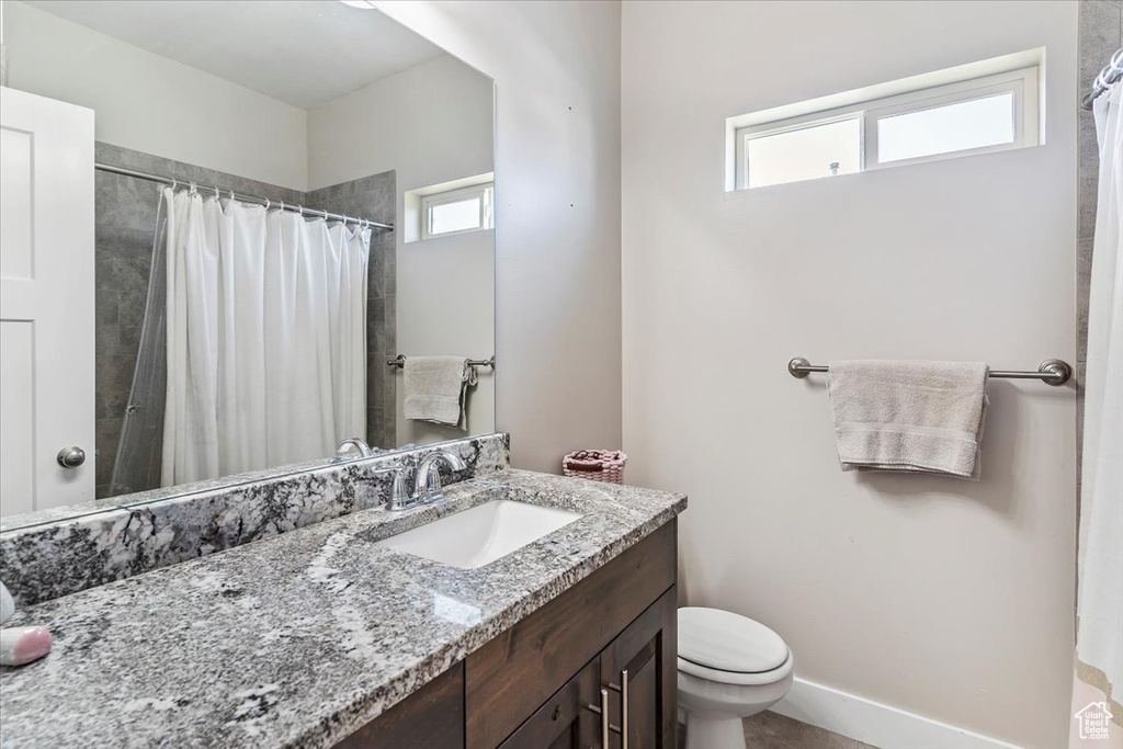 Bathroom featuring vanity and a shower with curtain