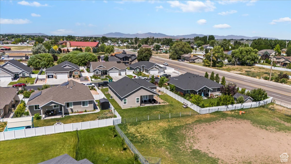 Aerial perspective of suburban area with a mountain backdrop