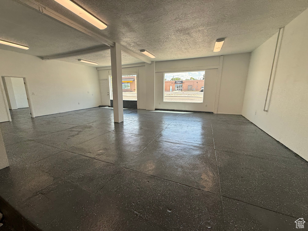 Unfurnished room with a textured ceiling