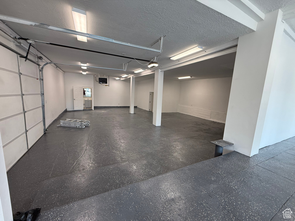 Garage featuring a garage door opener