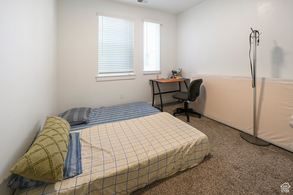 Bedroom featuring carpet