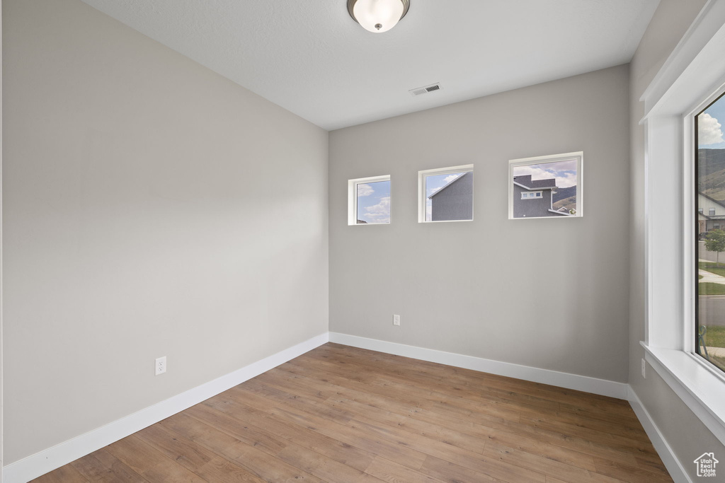 Unfurnished room featuring light wood finished floors