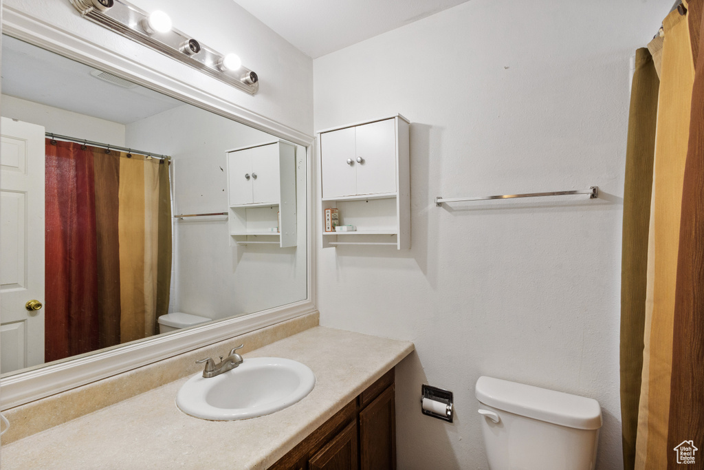 Bathroom featuring vanity and a shower with shower curtain