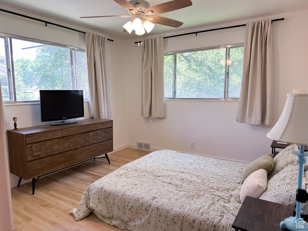 Bedroom featuring light wood finished floors and a ceiling fan