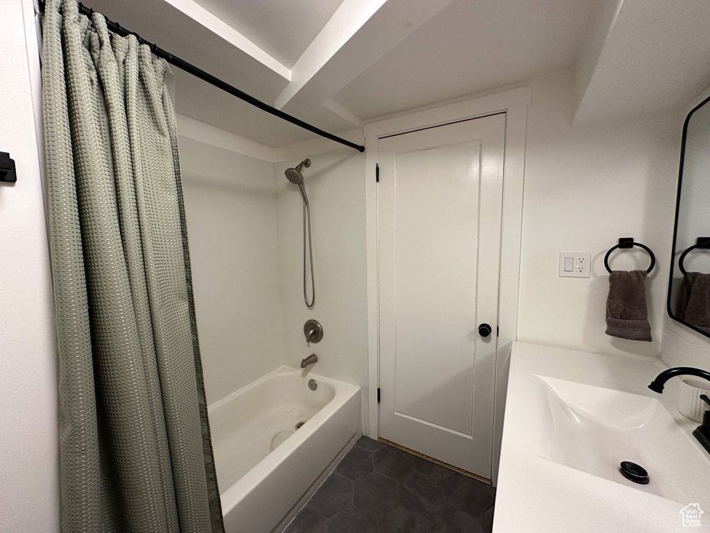 Full bathroom featuring shower / tub combo and tile patterned floors