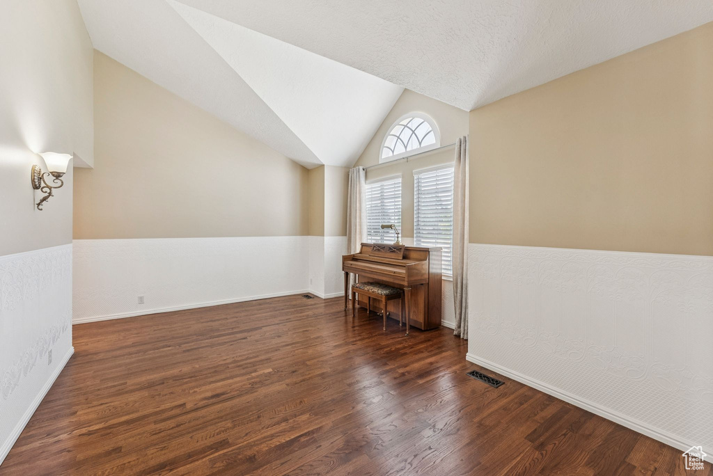 Bonus room with wood finished floors and lofted ceiling