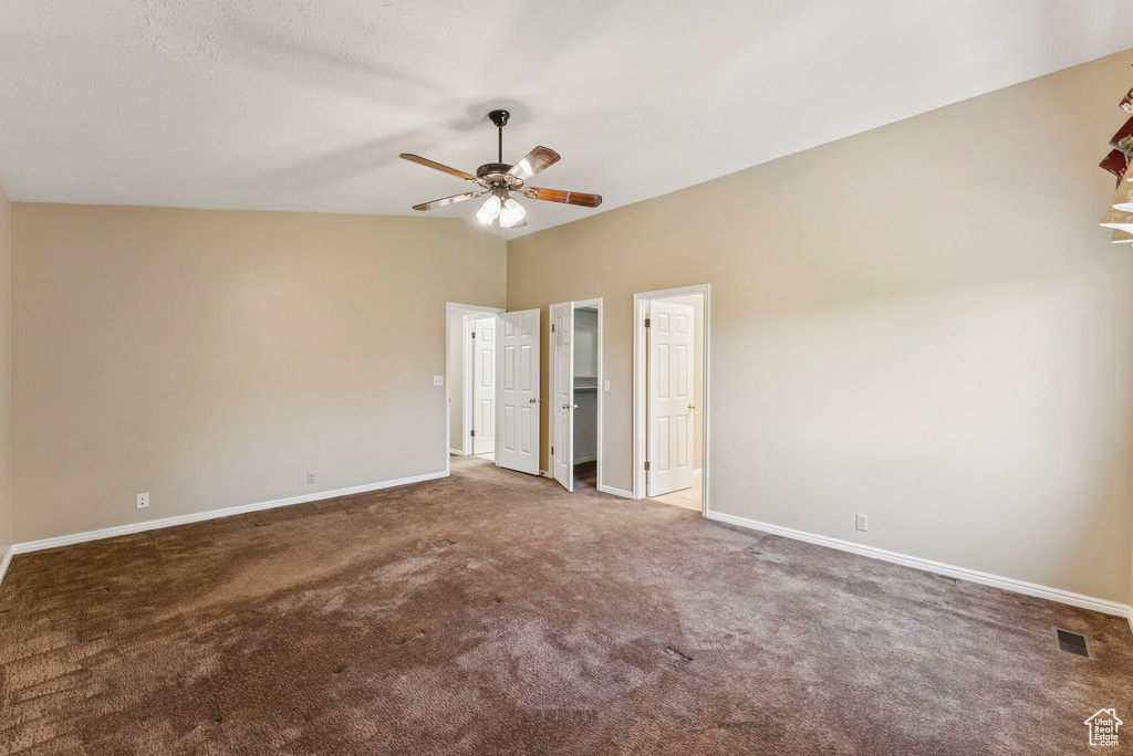 Unfurnished bedroom with carpet floors and ceiling fan