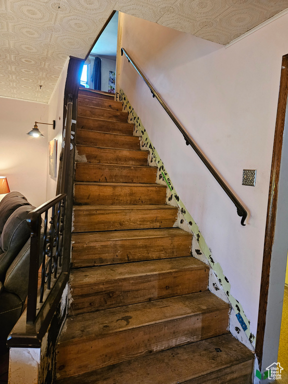 Staircase with an ornate ceiling