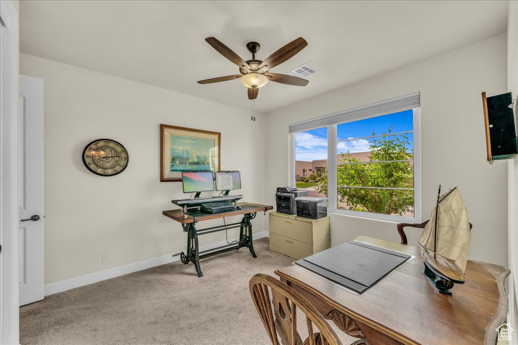 Office featuring a ceiling fan and light colored carpet