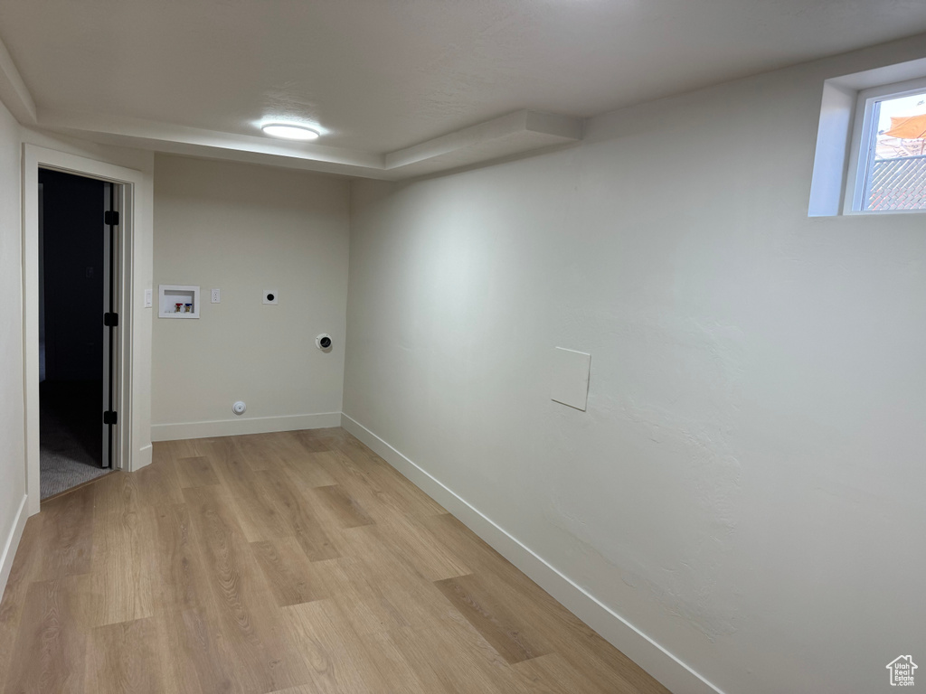 Washroom with electric dryer hookup, washer hookup, light wood-style flooring, and gas dryer hookup