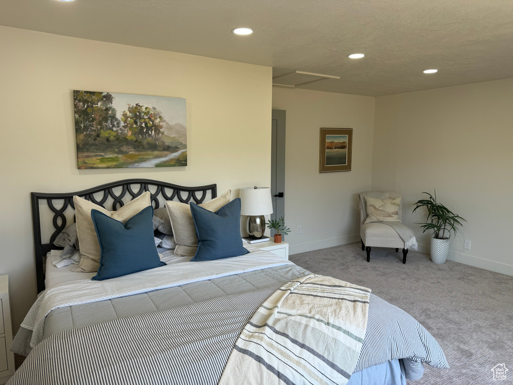 Bedroom featuring carpet flooring, recessed lighting, and attic access