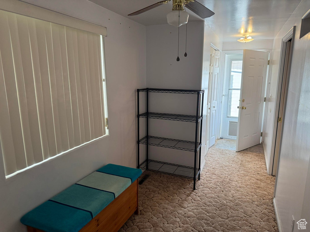 Unfurnished bedroom featuring carpet floors and a ceiling fan