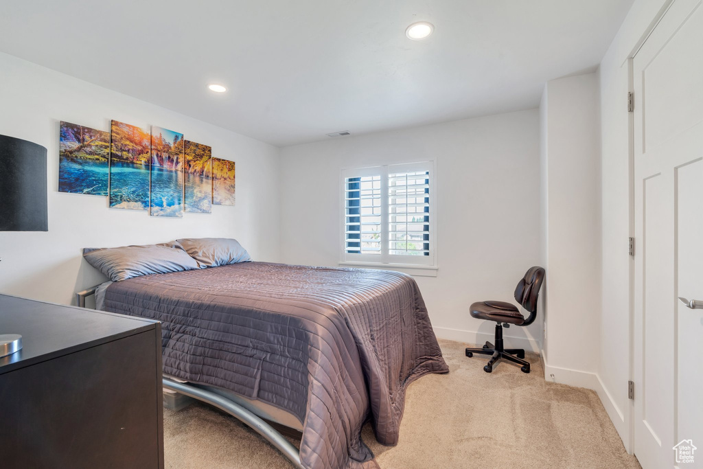 Bedroom featuring recessed lighting and light carpet
