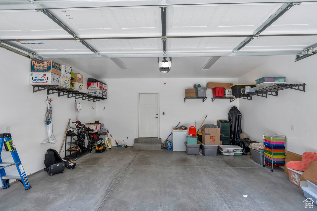 Garage featuring a garage door opener