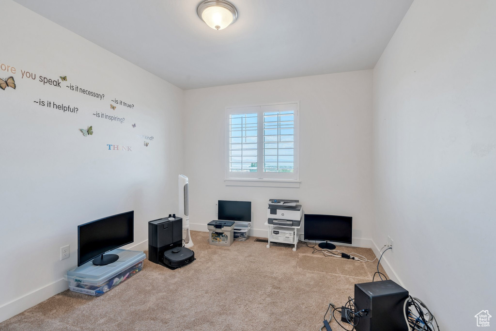 Living area featuring carpet flooring and an office area
