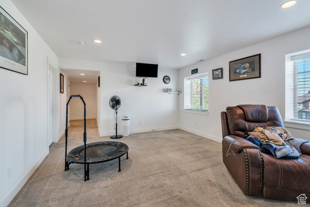Living room with recessed lighting and carpet flooring