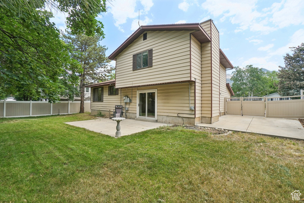 Back of house featuring a patio area and a fenced backyard